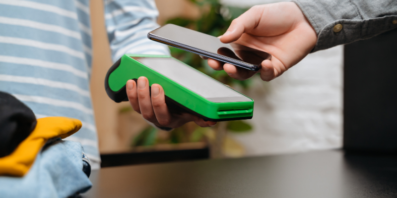 Customer using his phone to scan his digital loyalty card. 